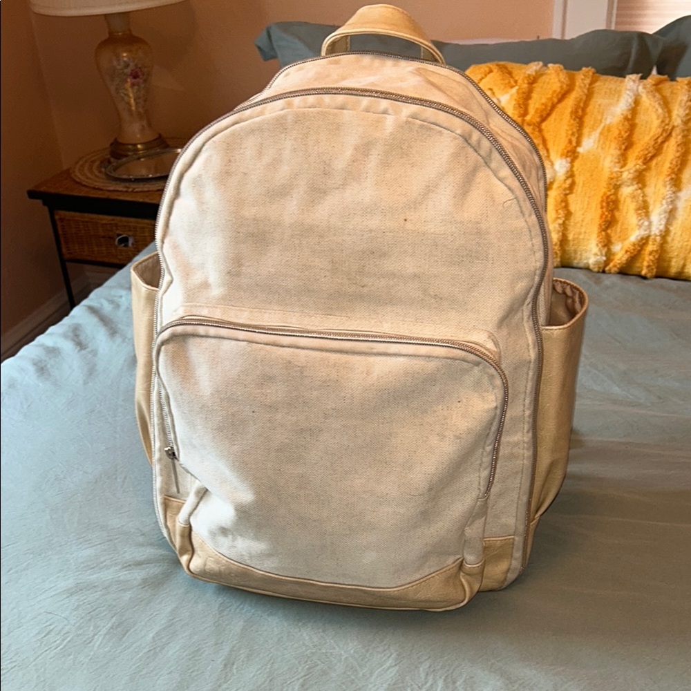 The Travel Backpack 
in Beige - fair used condition